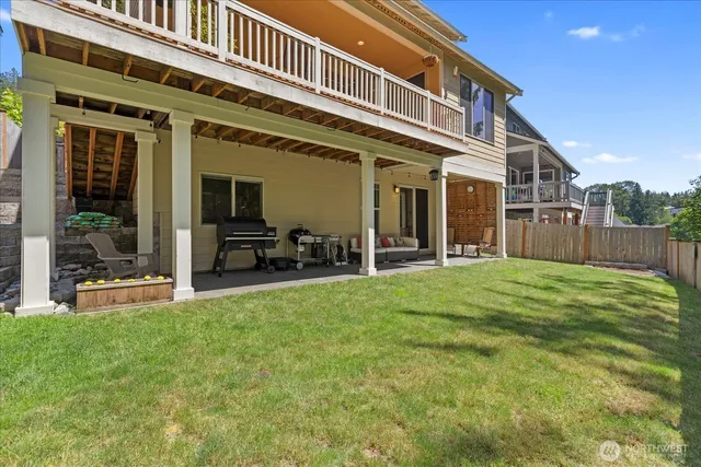 a kitchen with kitchen island a stove a refrigerator and a sink