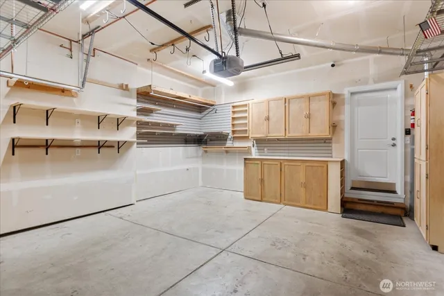 an aerial view of a house with a yard and a fountain