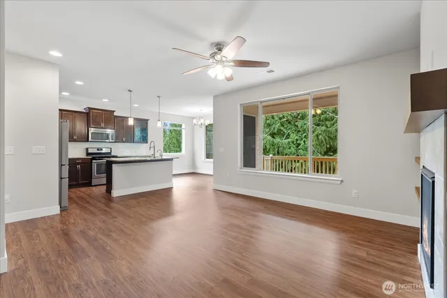 a view of kitchen with wooden floor and window