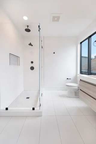 a bathroom with a bathtub and a shower