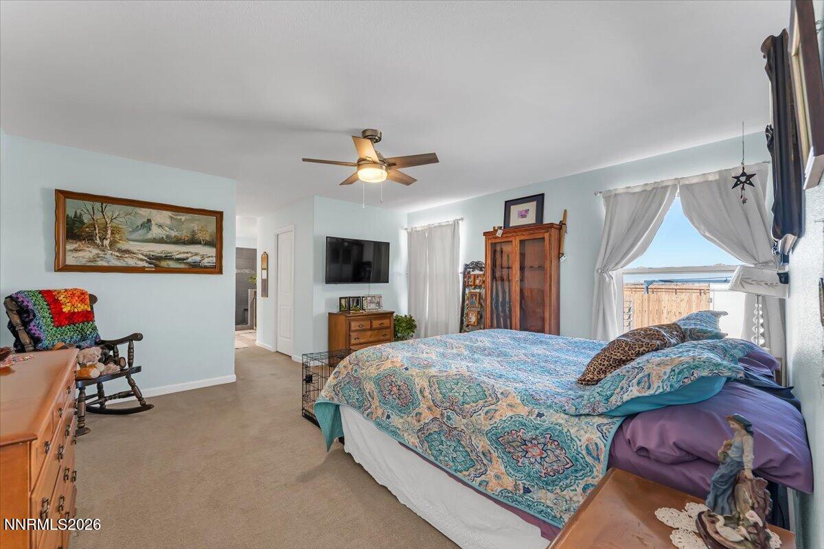 1197 Sky Ridge Drive Fallon, NV 89406 - Photo 20 of 79 a bedroom with furniture and a flat screen tv