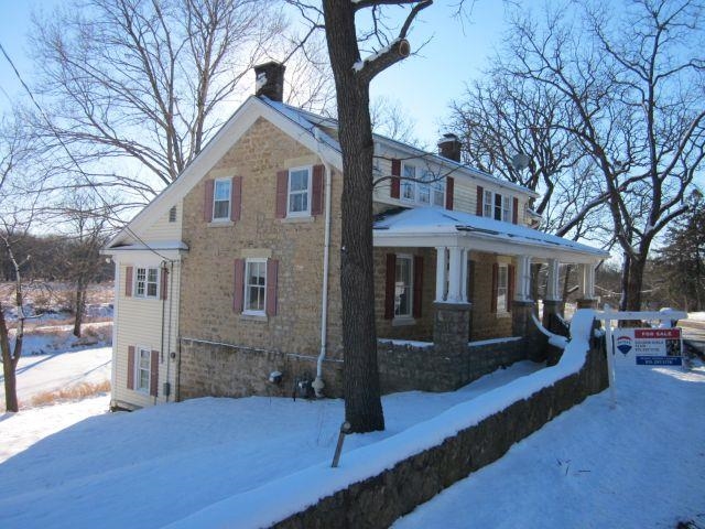 2243 East River Road Freeport, IL 61032 - Photo 18 of 33 a front view of a house with a yard
