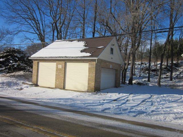 2243 East River Road Freeport, IL 61032 - Photo 19 of 33 a view of a house with a snow in the yard