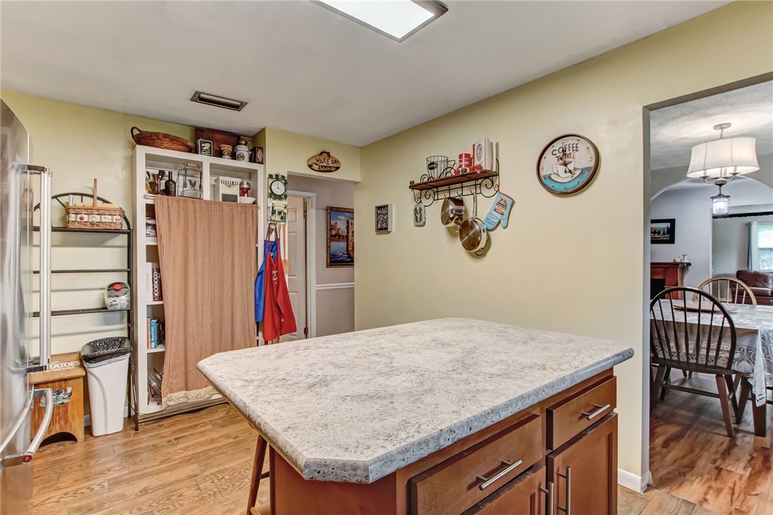 85091 Radio Avenue Yulee, FL 32097 - Photo 14 of 35 a view of a dining area with furniture and wooden floor