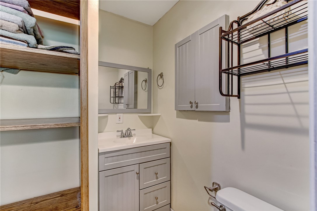 85091 Radio Avenue Yulee, FL 32097 - Photo 17 of 35 a bathroom with a sink toilet and mirror