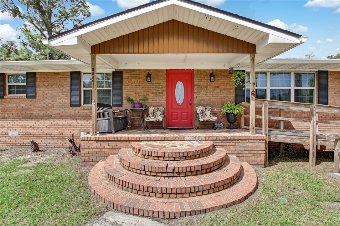 85091 Radio Avenue Yulee, FL 32097 - Photo 2 of 35 a front view of house with outdoor seating