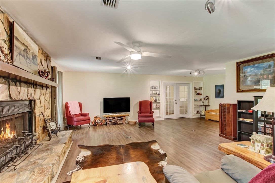 85091 Radio Avenue Yulee, FL 32097 - Photo 25 of 35 a room with fireplace furniture and a flat screen tv