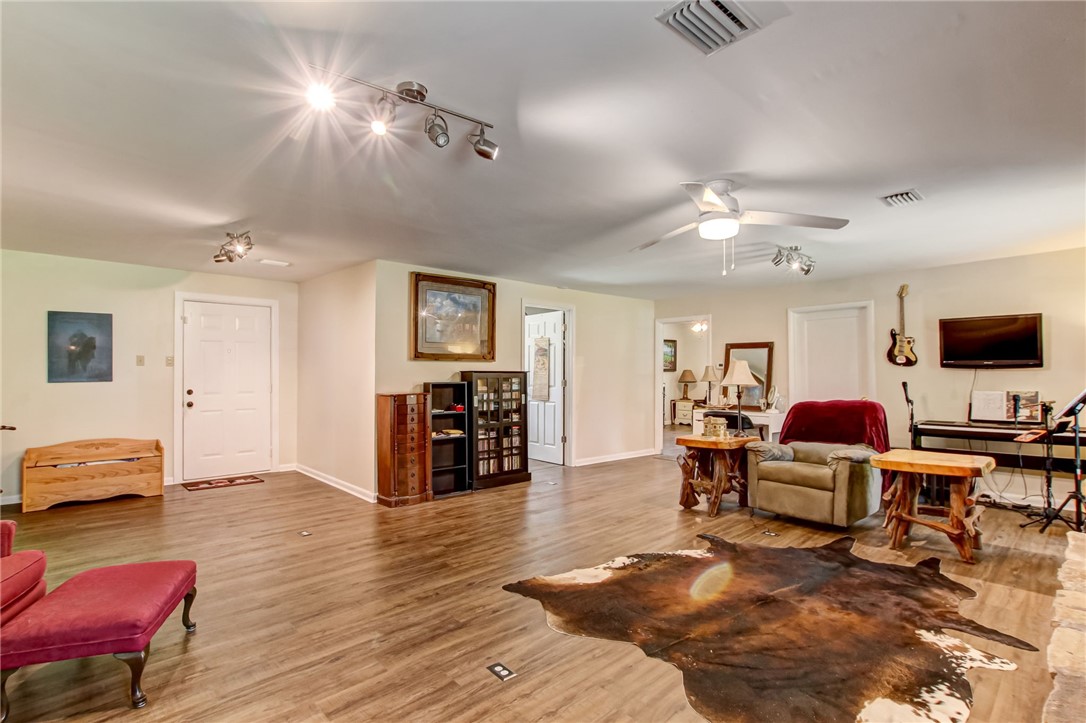 85091 Radio Avenue Yulee, FL 32097 - Photo 26 of 35 a living room with furniture and a flat screen tv