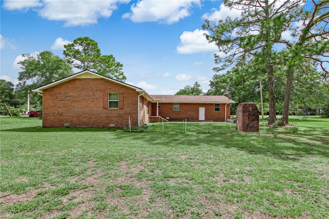 85091 Radio Avenue Yulee, FL 32097 - Photo 29 of 35 a front view of a house with a yard
