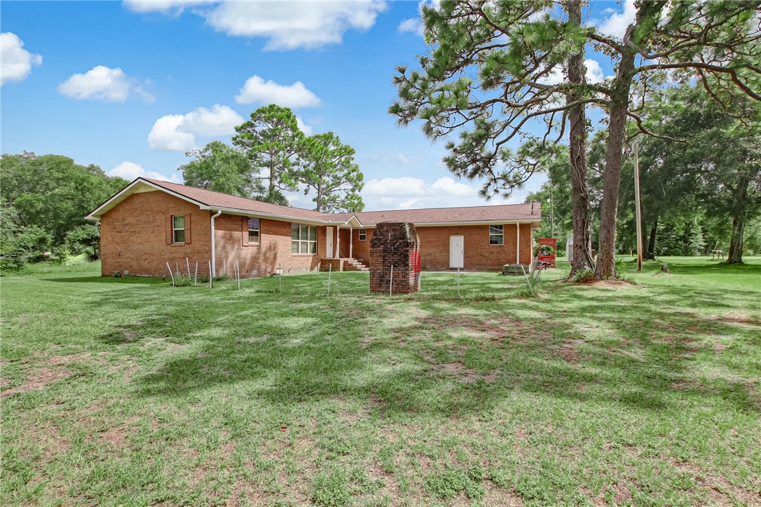85091 Radio Avenue Yulee, FL 32097 - Photo 30 of 35 a front view of house with yard and green space