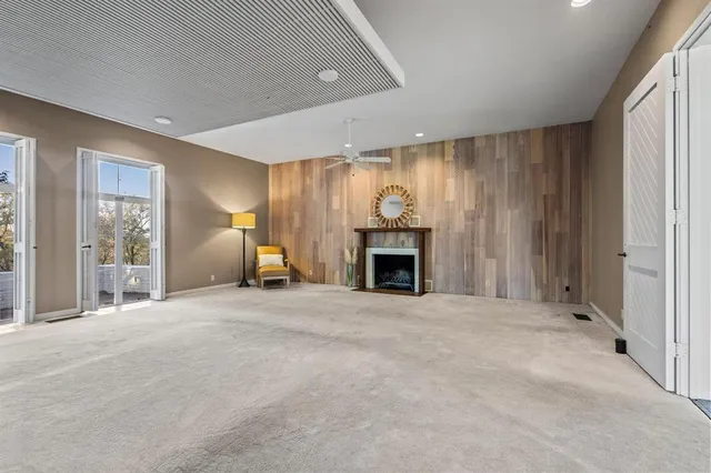 a view of an empty room with a fireplace