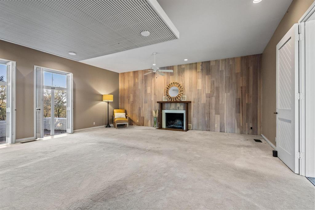 3906 Highland Drive Denison, TX 75020 - Photo 19 of 40 a view of an empty room with a fireplace