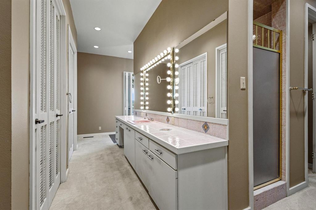 3906 Highland Drive Denison, TX 75020 - Photo 21 of 40 a bathroom with a double vanity sink mirror and double