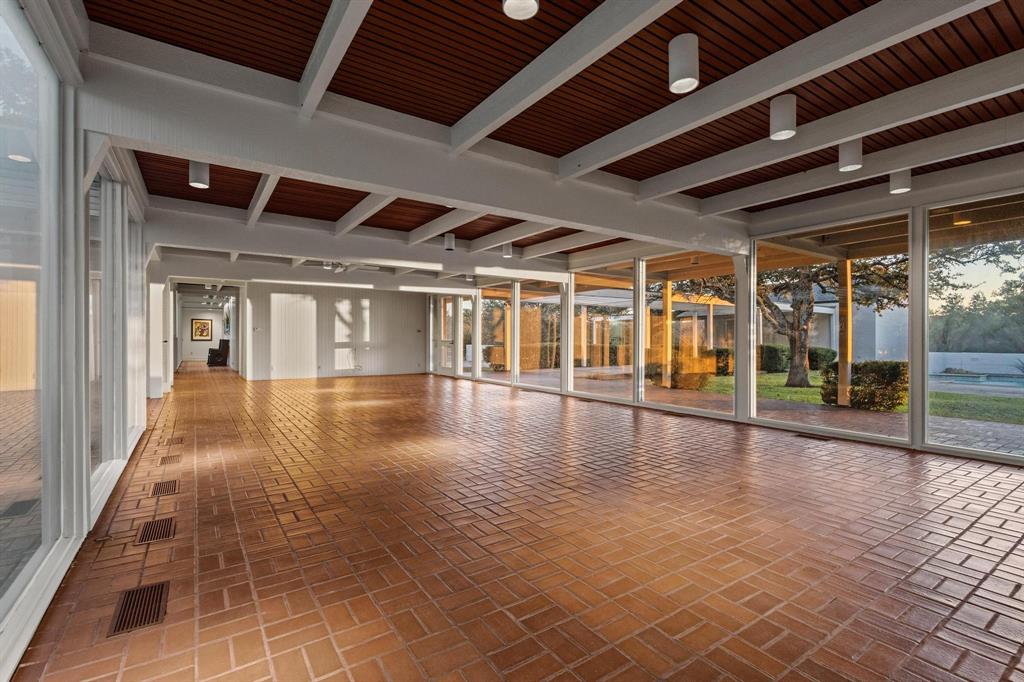 3906 Highland Drive Denison, TX 75020 - Photo 24 of 40 a view of a hall with wooden floor