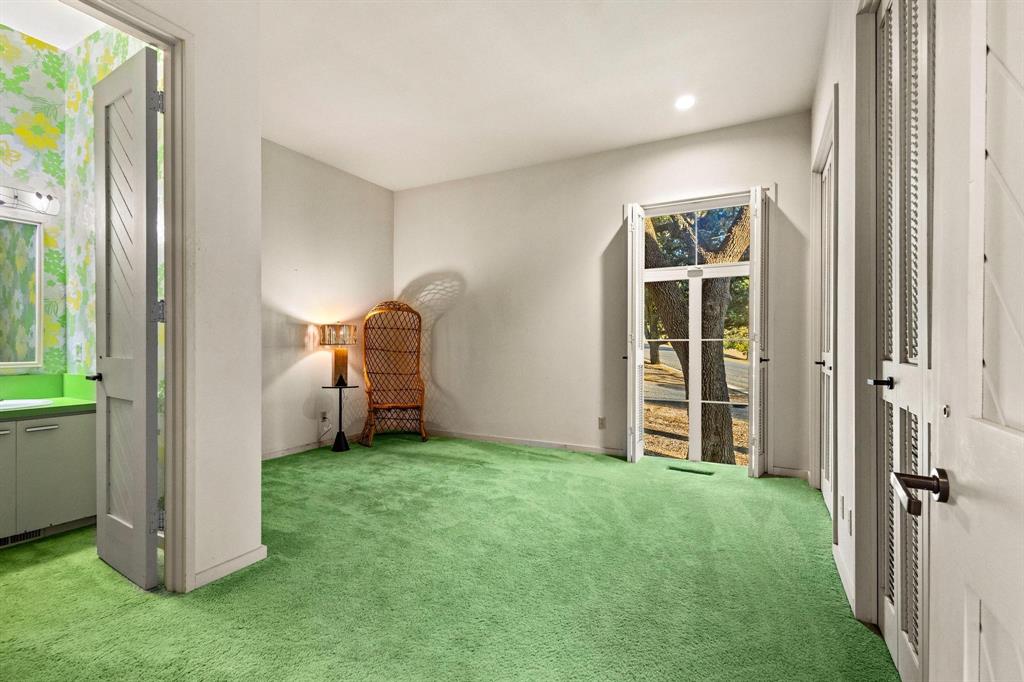 3906 Highland Drive Denison, TX 75020 - Photo 26 of 40 a view of a bedroom with closet window and a yard