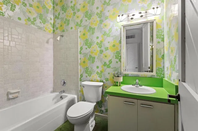 a bedroom with a bed and a mirror