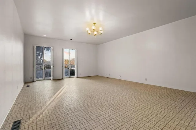 a view of a bathroom with sink and wooden floor
