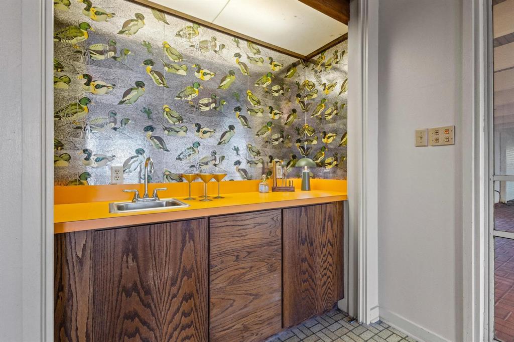 3906 Highland Drive Denison, TX 75020 - Photo 31 of 40 a view of a bathroom with sink and wooden floor