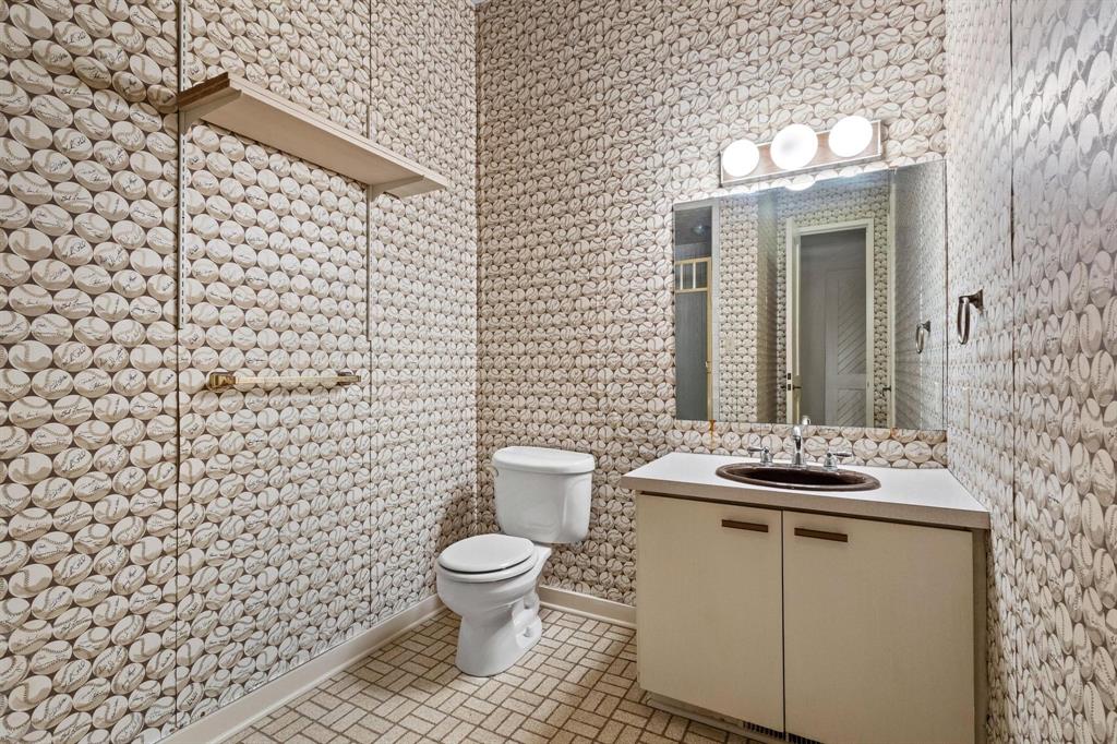 3906 Highland Drive Denison, TX 75020 - Photo 32 of 40 a bathroom with a sink toilet and shower