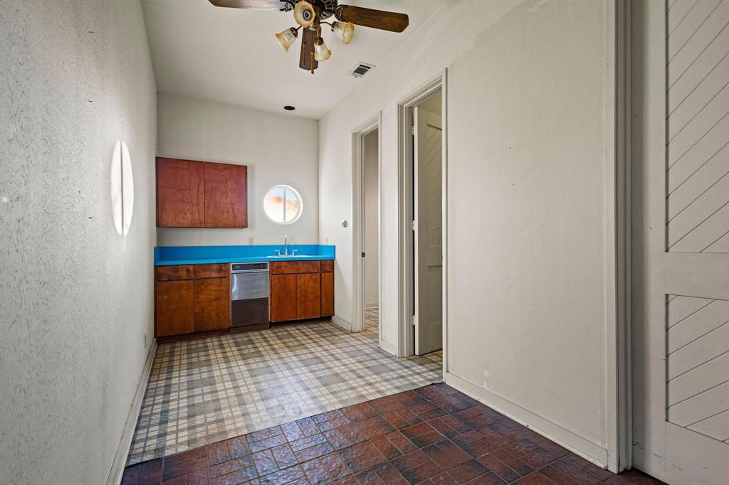 3906 Highland Drive Denison, TX 75020 - Photo 35 of 40 a bathroom with a sink a mirror and a shower