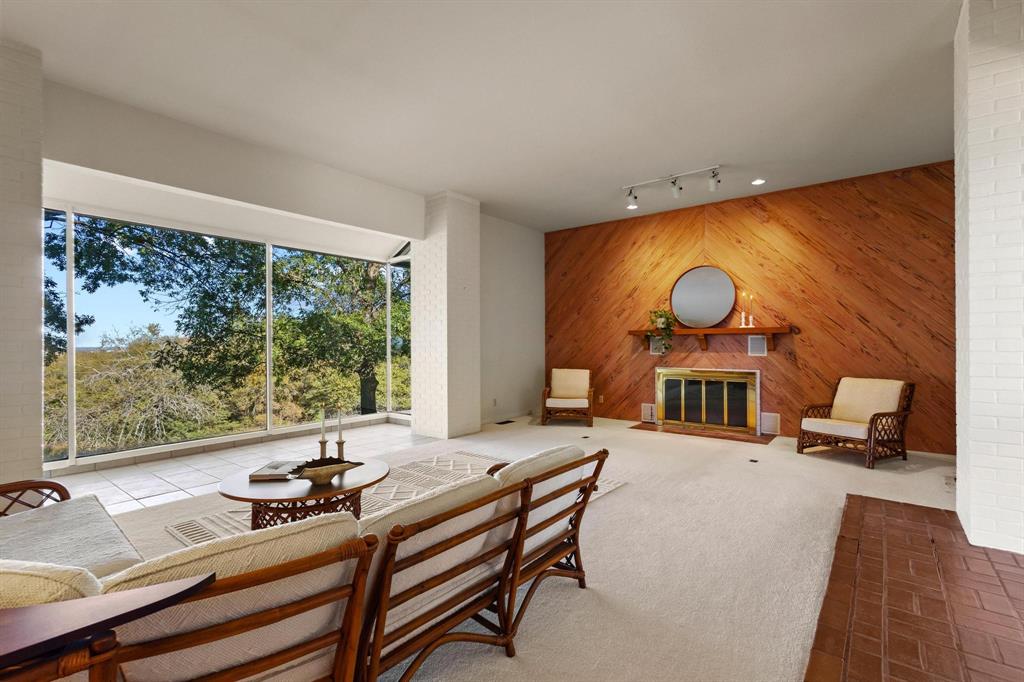 3906 Highland Drive Denison, TX 75020 - Photo 9 of 40 a living room with furniture and a floor to ceiling window