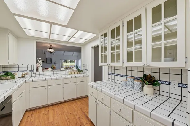 a kitchen with a sink and cabinets