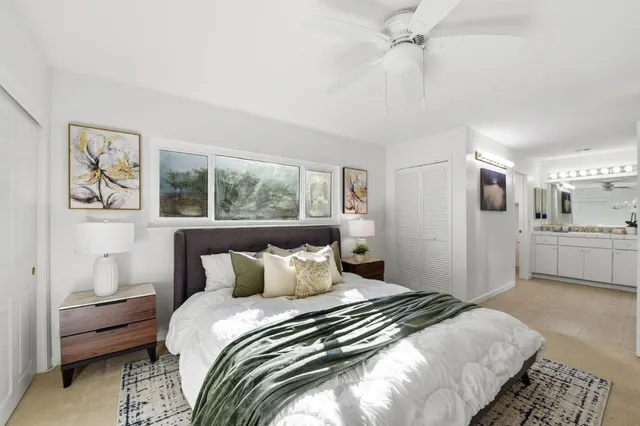 a bedroom with a bed and a couch