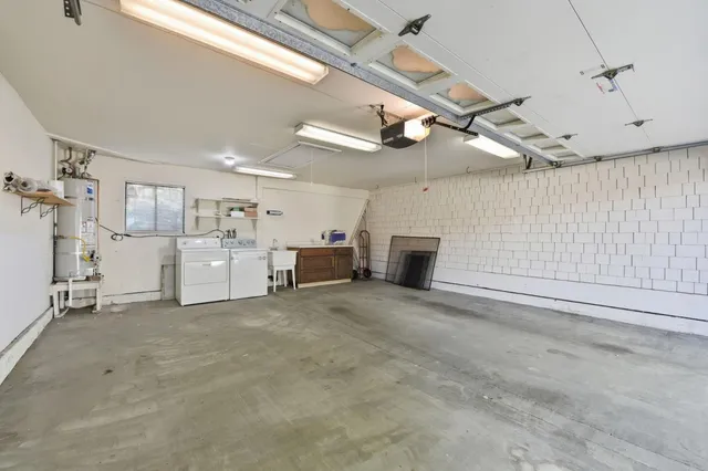a view of a livingroom with furniture and a fireplace