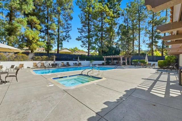 a view of a swimming pool with a patio