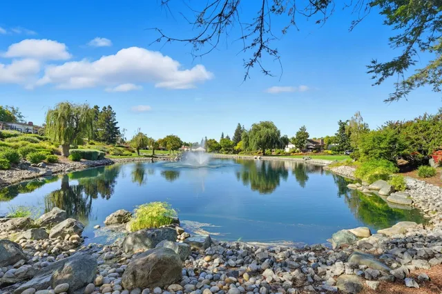a view of a lake with a house in the background