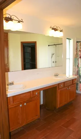 a bathroom with a sink and a mirror