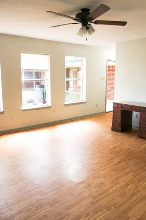 a view of an empty room with a window