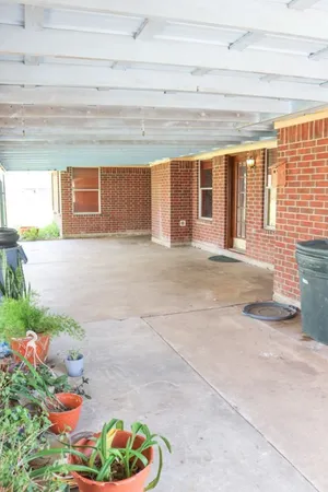 a view of porch with a dining table and chair