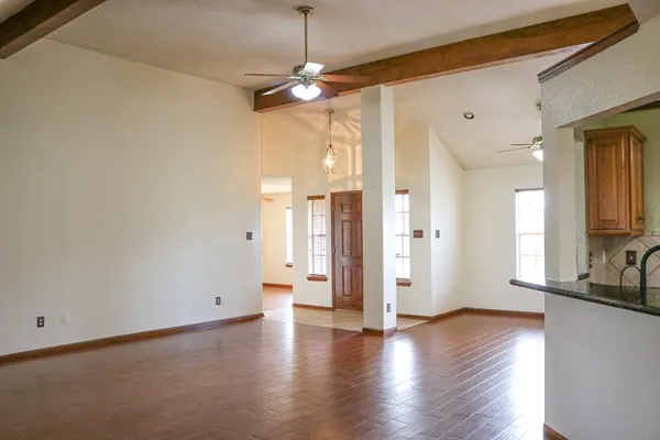 a view of a kitchen with a stove cabinets and wooden floor
