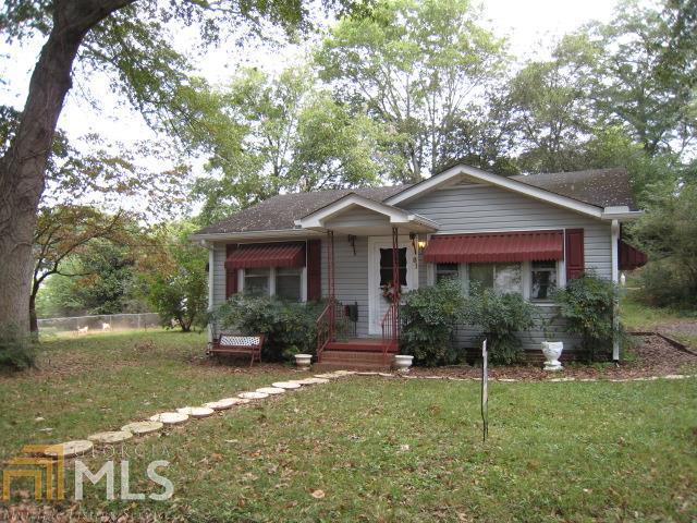 81 Wade Street Northeast Rome, GA 30161 - Photo 1 of 1 a front view of a house with garden