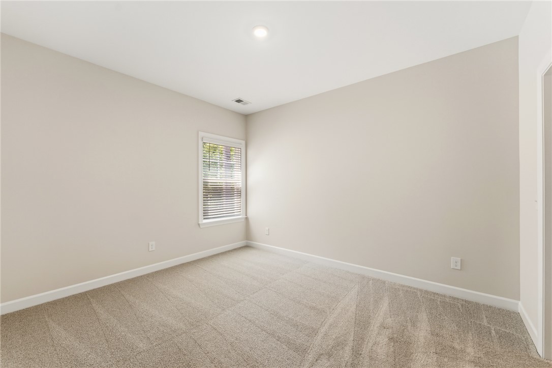 701 Weathered Oak Way Anderson, SC 29621 - Photo 32 of 41 This spacious bedroom offers ample natural light and a clean, versatile canvas for personal style.