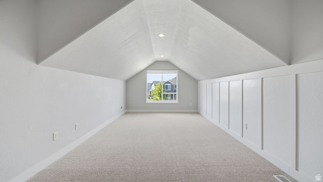 111 East Silver Oak Road Vineyard, UT 84059 - Photo 29 of 50 Carpeted attic space featuring a window, recessed lighting, and a paneled accent wall