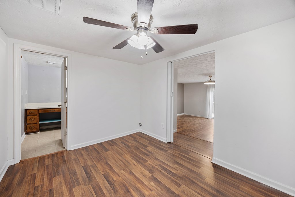 111 East Bon Acre Road Cataula, GA 31804 - Photo 8 of 16 wooden floor in an empty room with a window