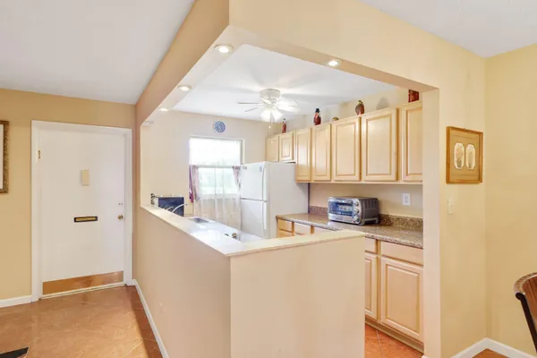 a kitchen with a sink a stove and refrigerator