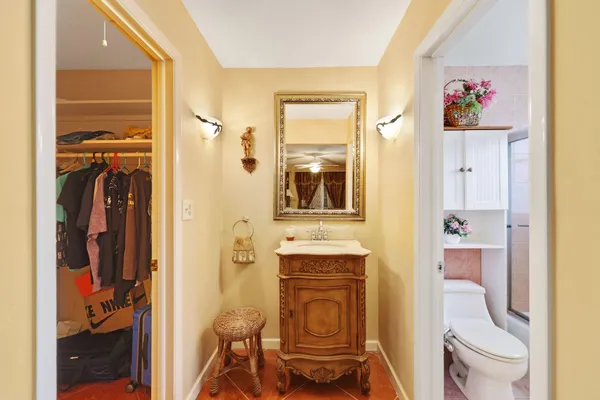 a bathroom with a toilet a sink and a shower