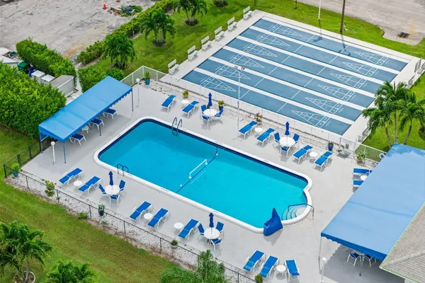 an aerial view of a chairs and table