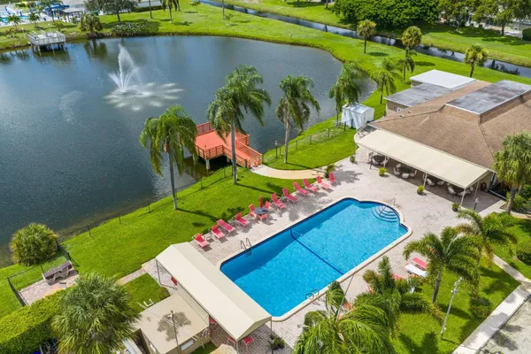 an aerial view of a house with a lake view