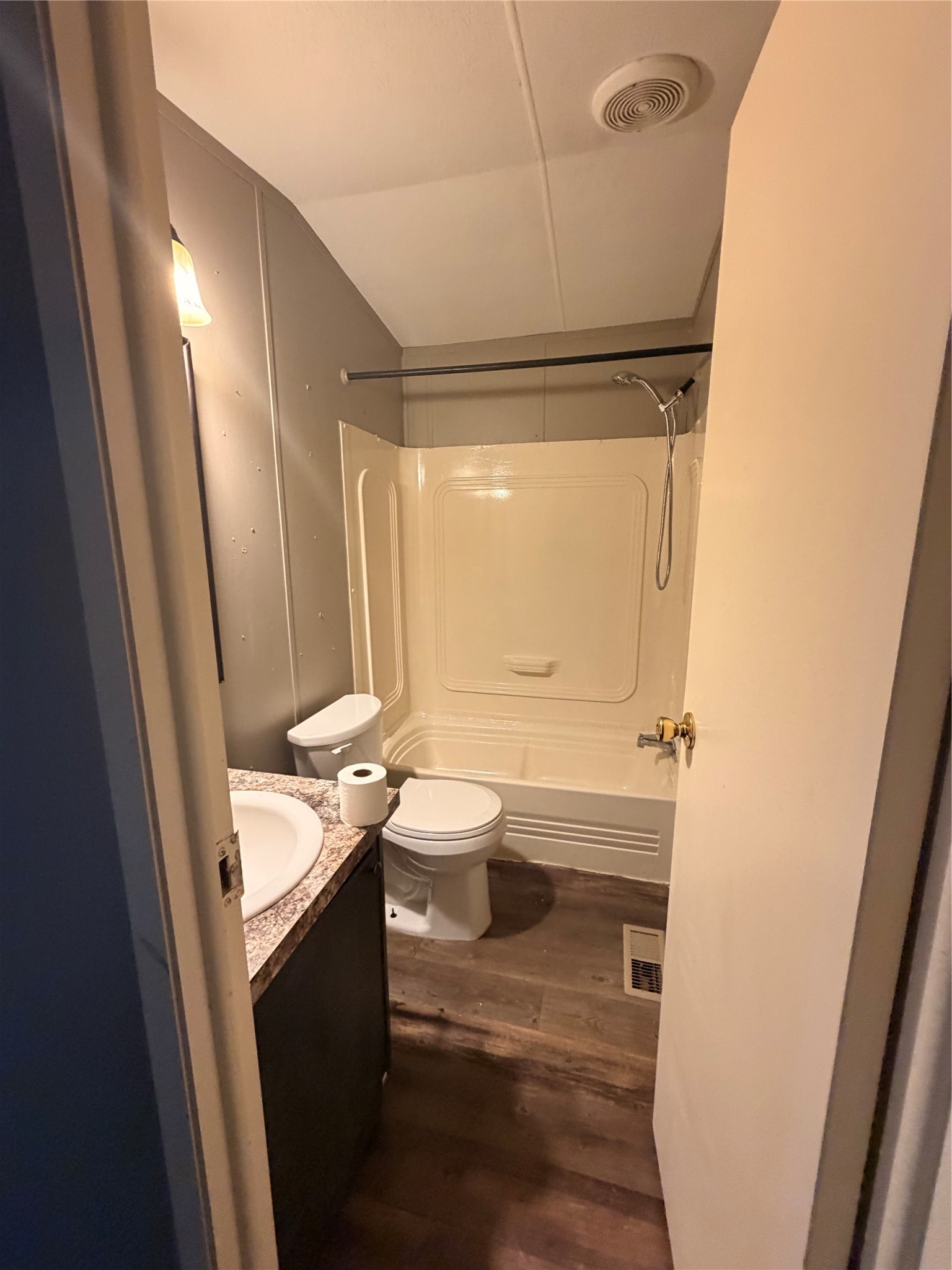2021 North Battlebell Road, Unit 40 Highlands, TX 77562 - Photo 10 of 19 a bathroom with a granite countertop sink toilet and shower
