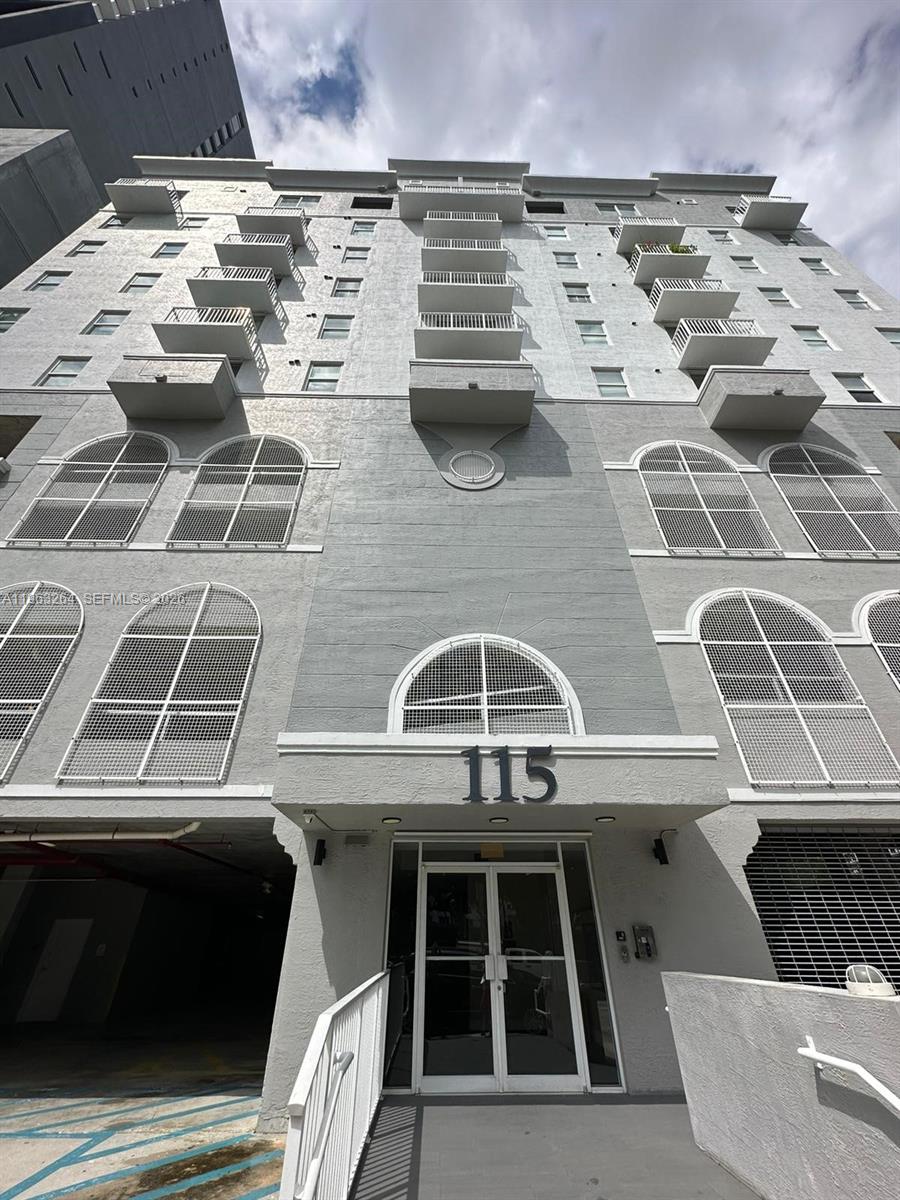 a view of a roof deck with a yard