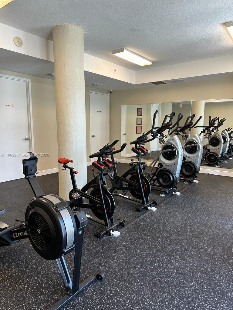 115 Southwest 11th Street, Unit 805 Miami, FL 33130 - Photo 11 of 13 a view of a room with gym equipment