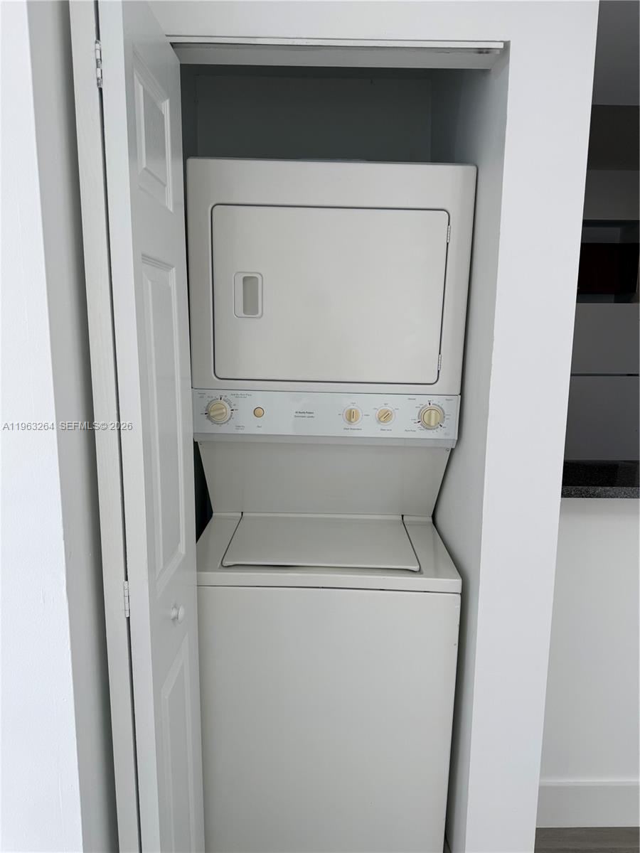115 Southwest 11th Street, Unit 805 Miami, FL 33130 - Photo 9 of 13 a utility room with dryer and washer