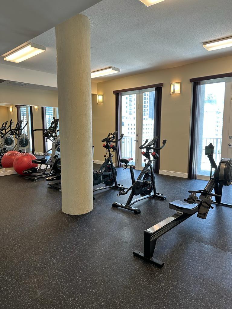 115 Southwest 11th Street, Unit 805 Miami, FL 33130 - Photo 10 of 13 a view of a room with gym equipment