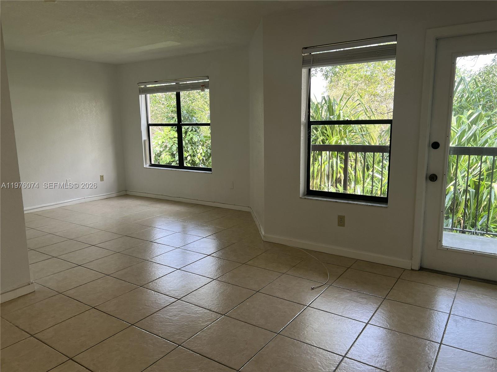 4221 West McNab Road, Unit 43 Pompano Beach, FL 33069 - Photo 11 of 23 an empty room with windows