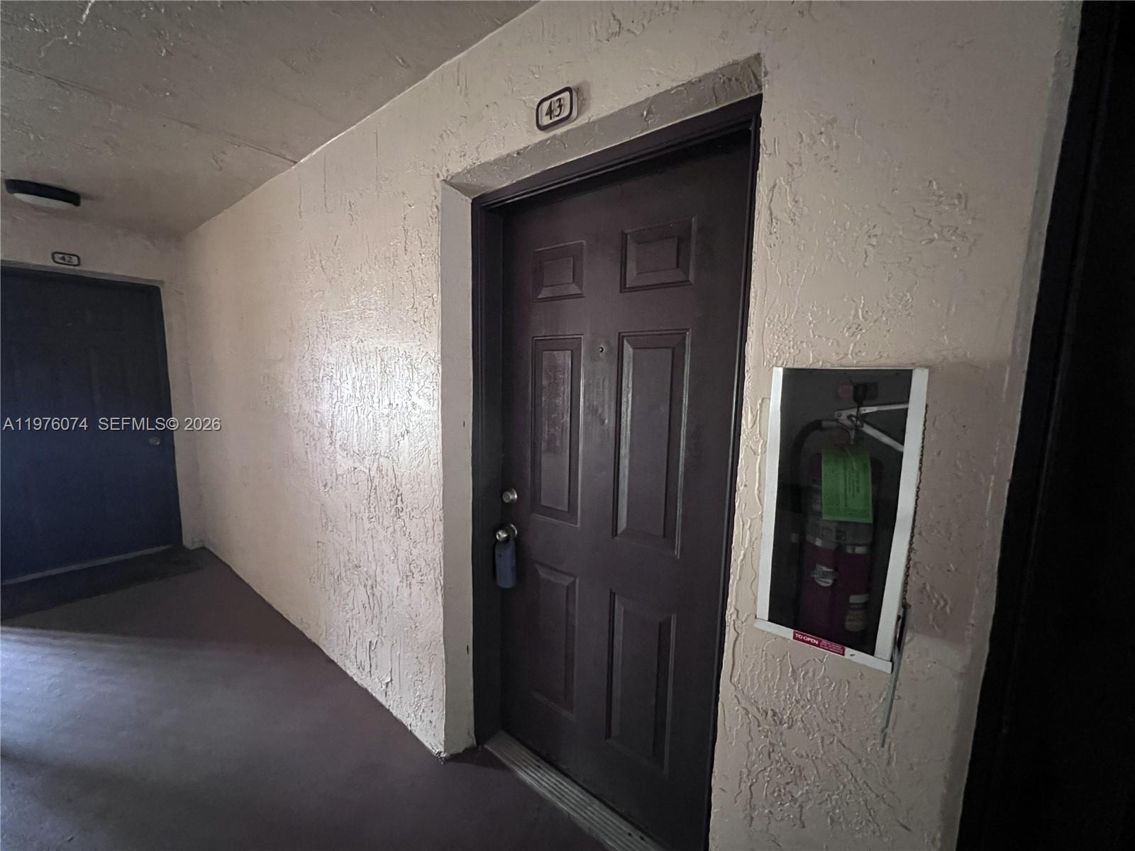 4221 West McNab Road, Unit 43 Pompano Beach, FL 33069 - Photo 15 of 23 a view of a hallway with wooden floor