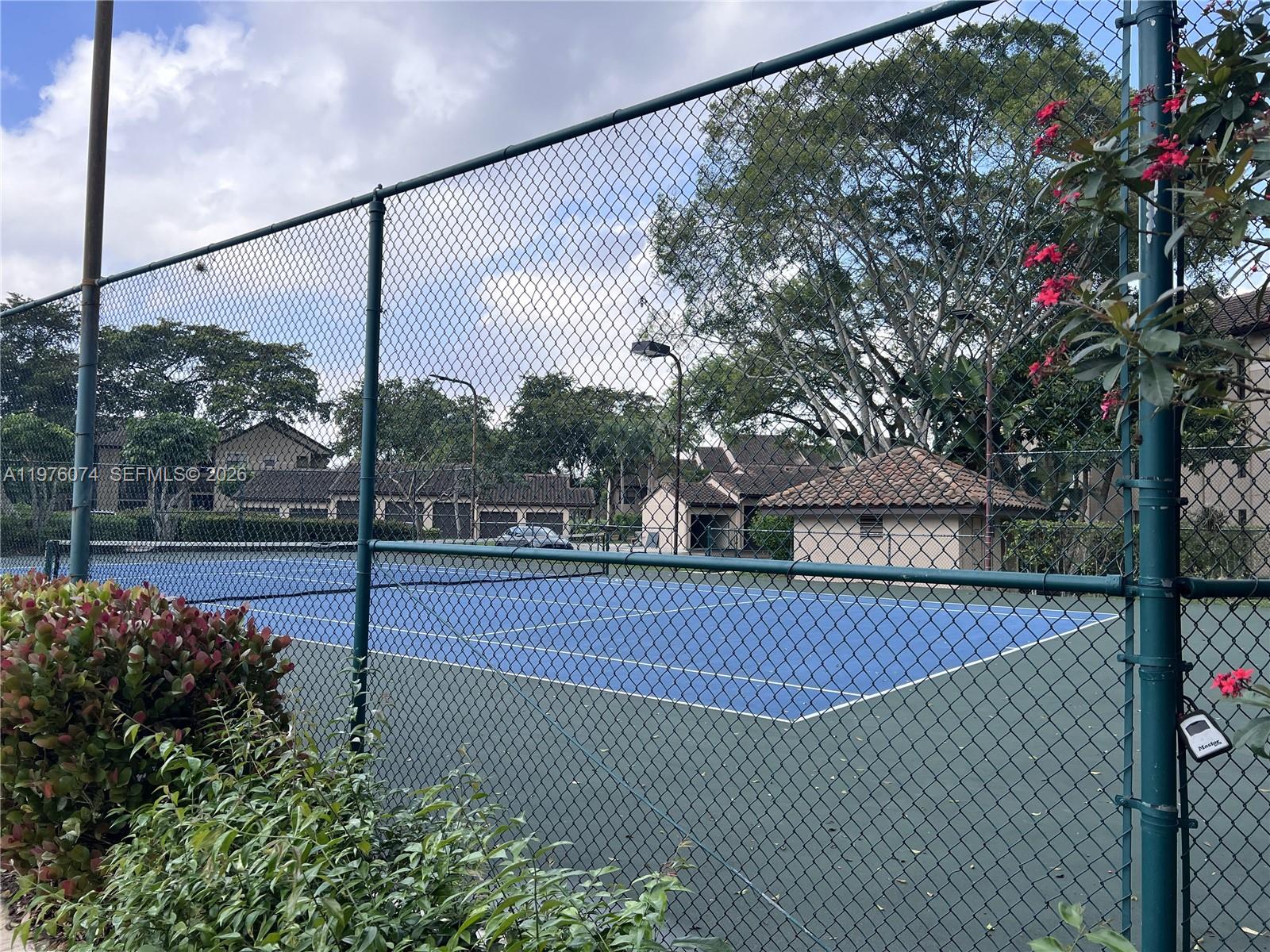 4221 West McNab Road, Unit 43 Pompano Beach, FL 33069 - Photo 22 of 23 a view of a tennis court